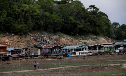 Floating houses and boats stranded at the Marina do Davi, a docking area of the Negro river, in Manaus.